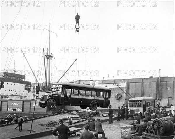 Loading A Bus On To A Ship