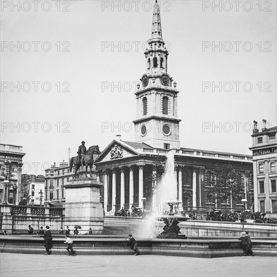 Fountain In Trafalgar Square Showing Equestrian Statue Of Charles I And St Martin-In-The-Fields.