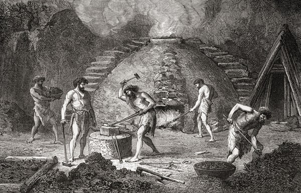 Men working at a primitive furnace used for the extraction of iron during the Iron Age.