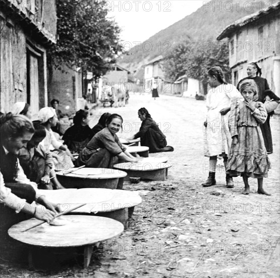 Making native bread in the streets of Berkovites, Bulgaria.