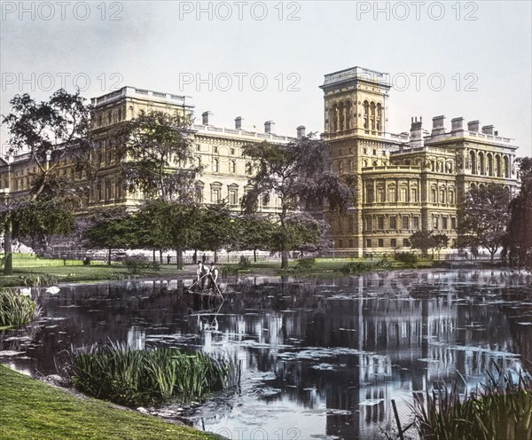 Government buildings from St James Park with pond in front.