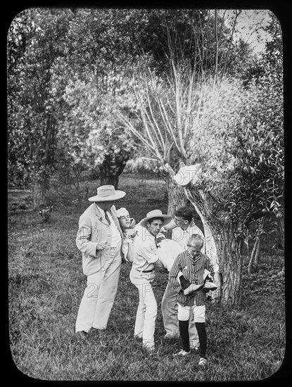 A master and children carrying a child for first aid assistance.