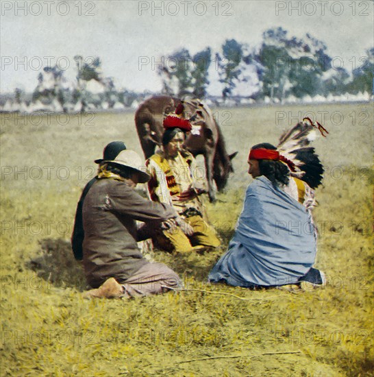 Passing the peace pipe around the council, native American Indians.