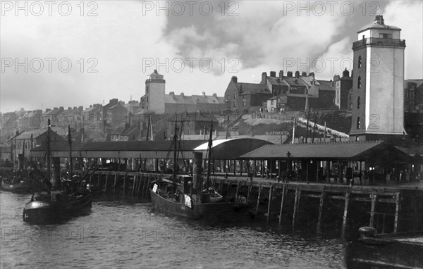 Fish Quay with fishing boats and buildings.