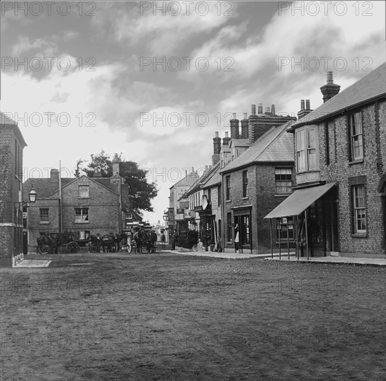 Coaching inn with horses and coaches outside.