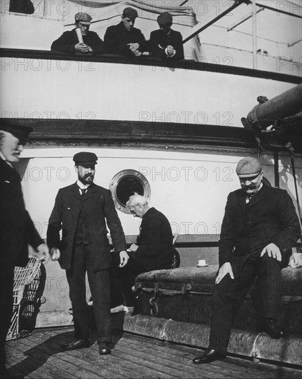 Crew and passengers on board ship.