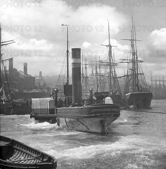 The steam paddle tug 'Victoria' on the River Wear.