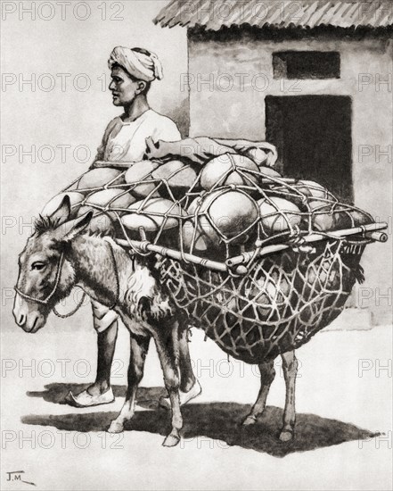 Carrying pots to market in India.