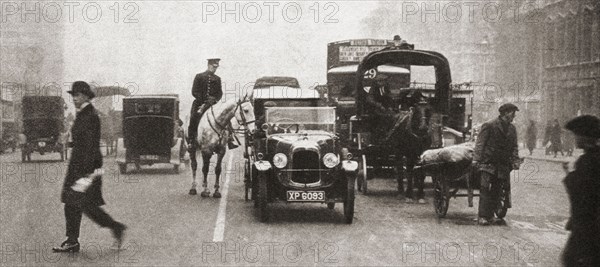 The first white line to be laid down in a London Street as an experiment in solving the traffic congestion.