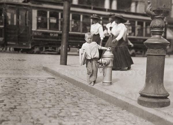 Child newspaper vendor.