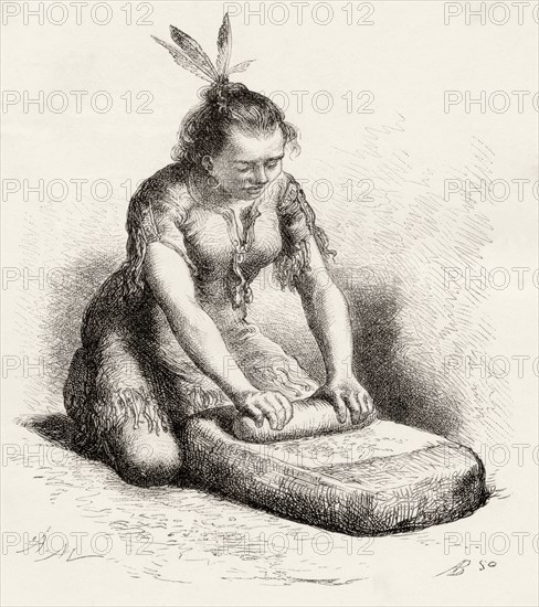 A native Guayan woman crushing grain.