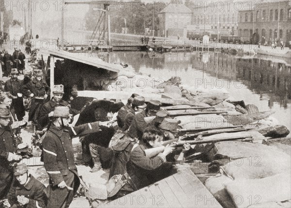 Belgian soldiers defending the sandbagged Willebrock Canal from the advancing Germans during WWI.