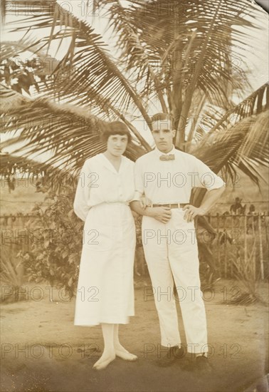 Mr and Mrs Tamlin in the shade of a palm tree