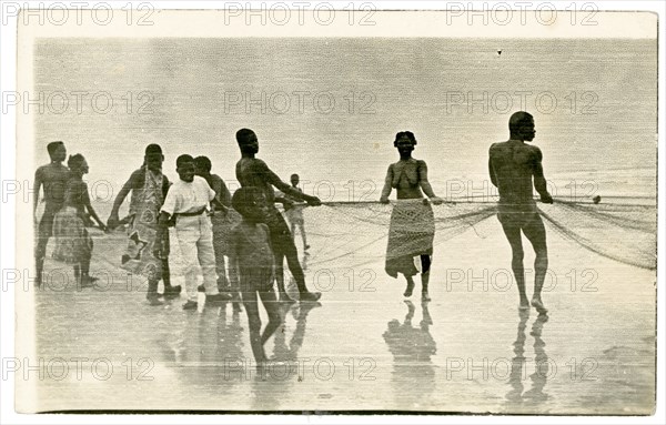 Net fishing along the beach