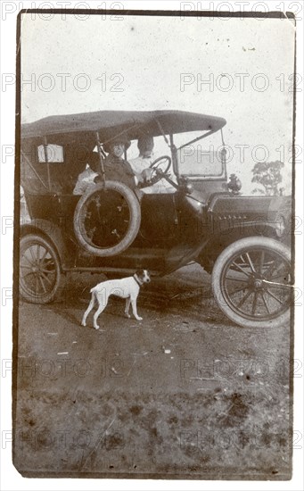 Alfred Tamlin driving a car