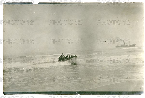 Rowing boat off the coast