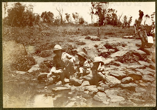 African man by river rapids