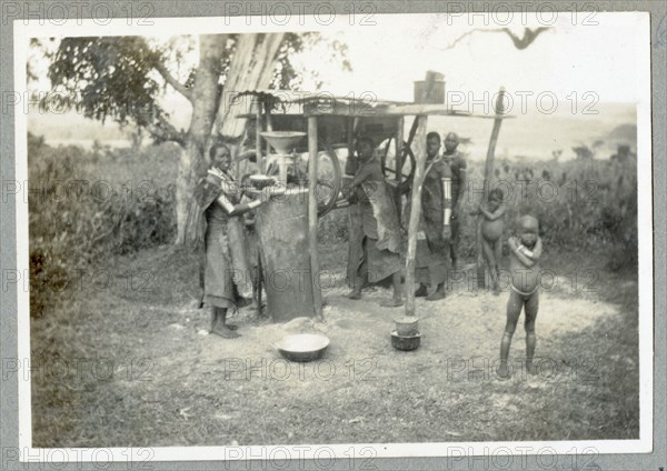 Nandi women grinding maize