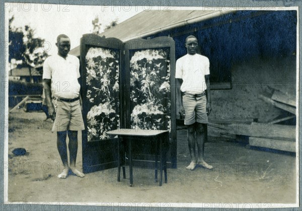 Apprentices show off a folding screen