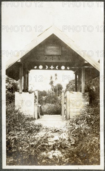 Gateway with wooden cross