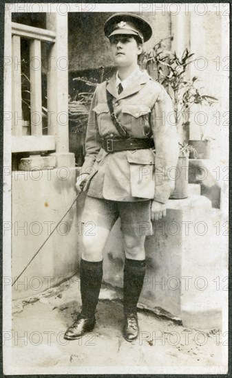 Portrait of European woman dressed up in army uniform