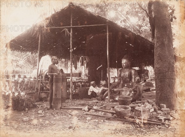 Burmese craftsmen making Buddha sculptures