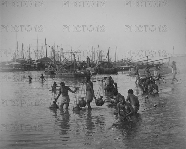 Sampan fishing boats and Indian water-carriers, Calcutta