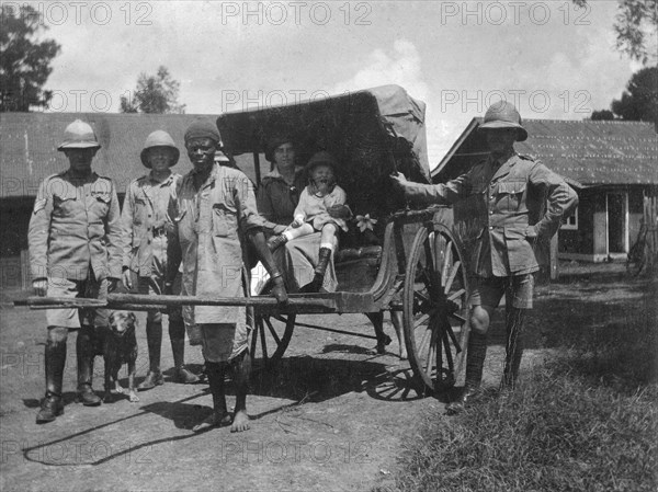 May Bungey in a rickshaw with army officers