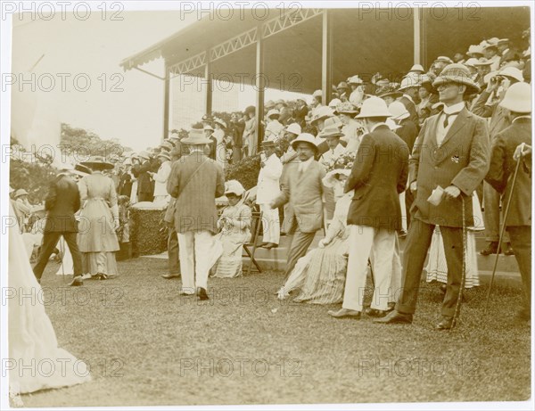 Mixed group of spectators before grandstand, Colombo Racecourse