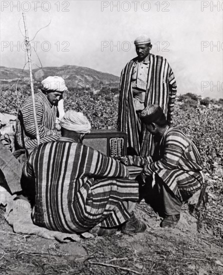 Russian Peasants Listening To Radio