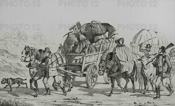 Emigrants on carts heading out West. Engraving by Vernier. Panorama Universal. History of the United States of America, from 1st edition of Jean B.G. Roux de Rochelle's Etats-Unis d'Amérique in 1837. Spanish edition, printed in Barcelona, 1850.