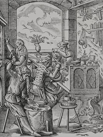Goldsmith. Reproduction of a 16th-century engraving by Jost Amman. ""Moeurs, usages et costumes au moyen-age et a l'epoque de la Renaissance"", by Paul Lacroix. Paris, 1878.