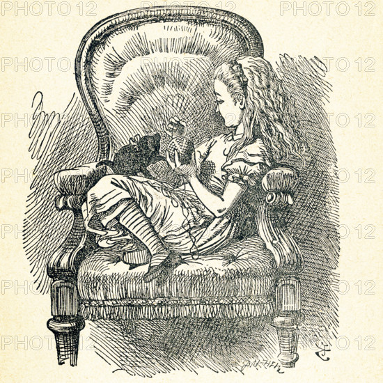 This illustration of Alice sitting with a black cat in a chair in the house is from ""Through the Looking-Glass and What Alice Found There"" by Lewis Carroll (Charles Lutwidge Dodgson), who wrote this novel in 1871 as a sequel to ""Alice's Adventures in Wonderland."" The black cat here is ""Kitty,"" the kitten of Dinah, Alice's cat in the Wonderland novel.