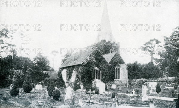 This photograph, which dates to 1922 or before, shows Stoke Pogis and St. Giles' Church. The spelling is also Stoke Poges. The historical link of the town of Stoke Poges in Buckinghamshire, England, is to English poet Thomas Gray, whose mother was buried in the cemetery here and who began work on his ""Elegy in a Country Churchyard"" in 1742 while visiting here and finished the poem here in 1750. Gray was also buried here.