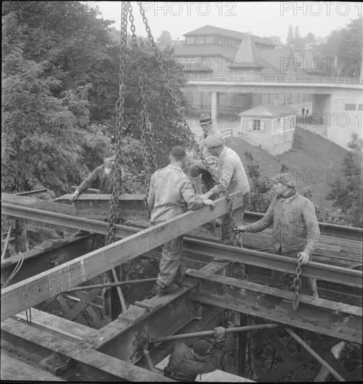Construction worker demolishing a railway bridge 1941.