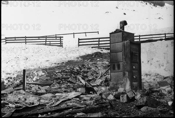 Remains of a fire burning down the alp restaurant Frakmunt; stove 1969.