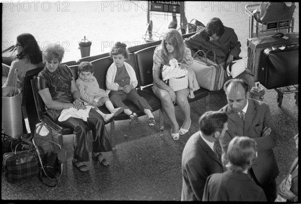 Tourists at airport Zurich-Kloten 1971.