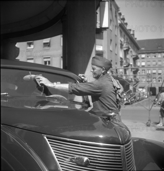 Filling Station Attendant Cleans Window, 1950.