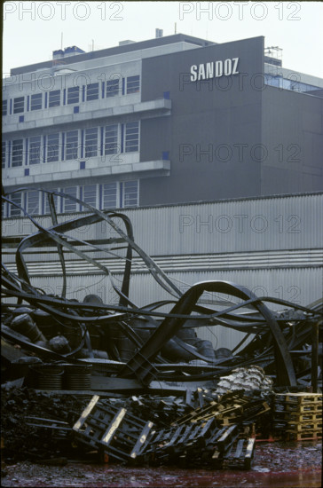 Fire Schweizerhalle 1986: destroyed warehouse in front of Sandoz-logo.