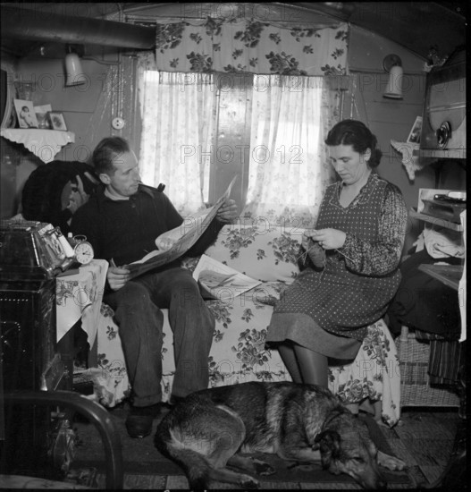 Yenish couple in living room, 1942.