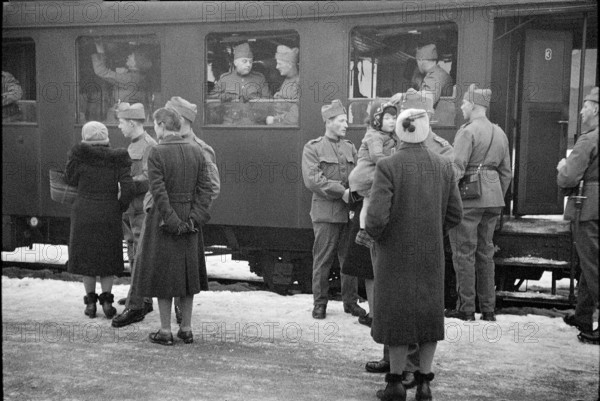 Soldiers saying goodbye; probably 1940.