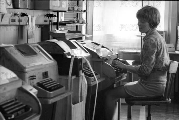 UPI office, telexist at telex terminal, 1970.