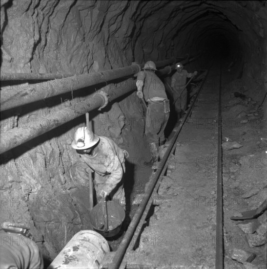 Lobbia power station: clearing tunnel of overburden 1957.