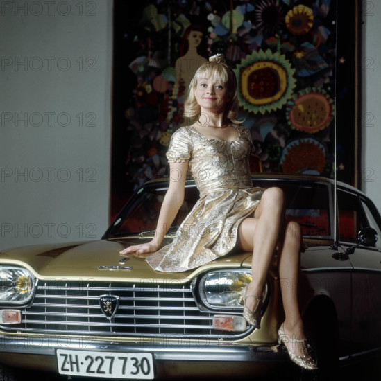 Ines Torelli on Peugeot 204.