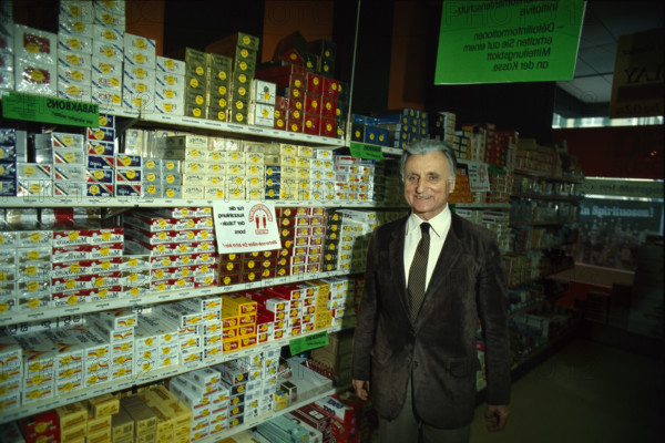 Karl Schweri in front of tobacco shelfs, 1984.