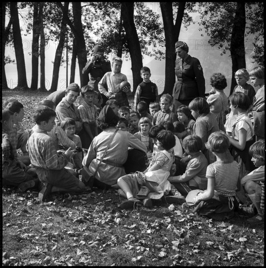 Women soldiers looking after children in vacation camp 1961.