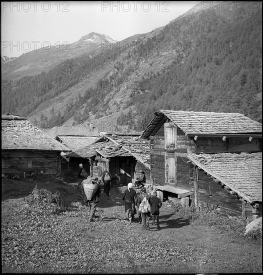 Farmers meet for cheese donation in the Turtmanntal valley, Switzerland, 1940.