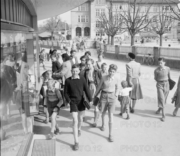 Dietikon; boys carrying schoolbag after school; 1955.