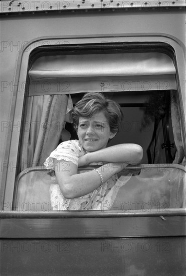 Rita Pavone looking out of train window 1966.