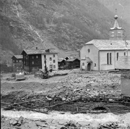Devastation in the Valais village Tasch after flood; 1957.